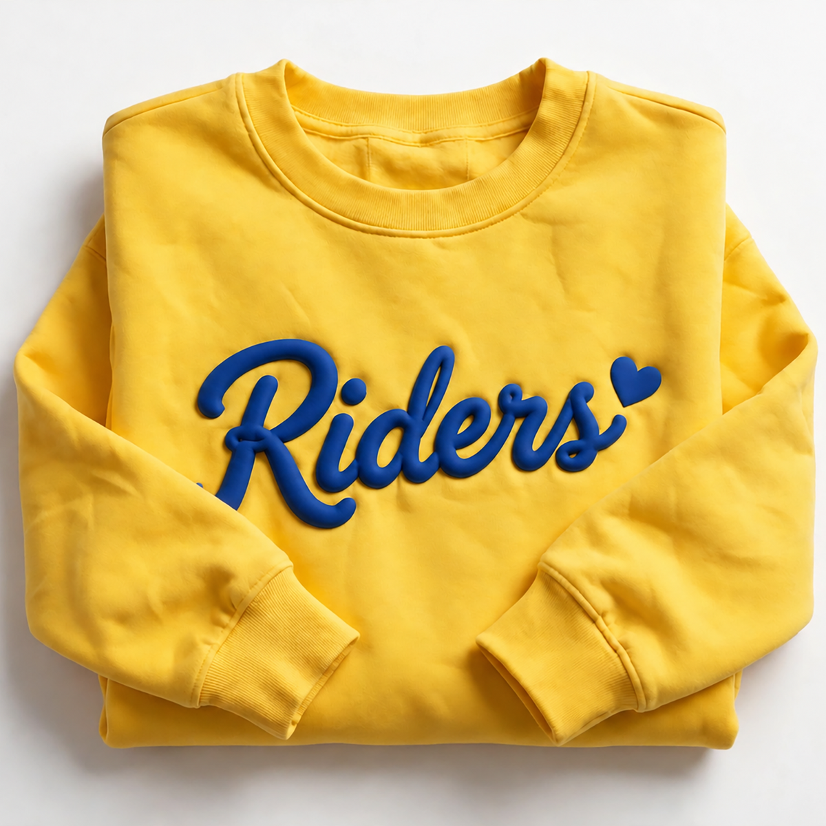 A folded yellow crewneck sweatshirt with 'Riders' embroidered in blue across the chest, set against a plain white background.