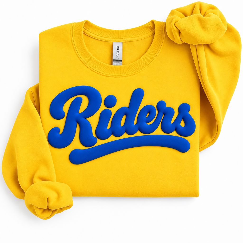 A folded yellow sweatshirt with a large blue 'Riders' graphic across the front, styled with rolled sleeves on a white background. The neck tag shows the brand Gildan.