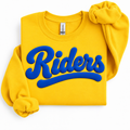 A folded yellow sweatshirt with a large blue 'Riders' graphic across the front, styled with rolled sleeves on a white background. The neck tag shows the brand Gildan.